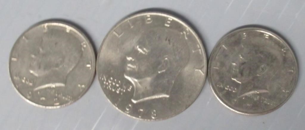 Eisenhower Dollar and (2) Kennedy Half Dollars in