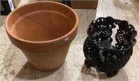 Large terra-cotta pot and a metal pot stand. Pot