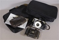 Two vintage cameras and accessories bags