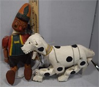 Two folk art puppets Pinocchio and spotted dog Dal