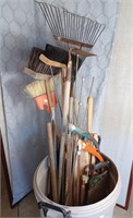 Assorted shop tools including bow saws,