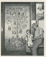 8x10 Puppeteer with doll in front of painting