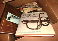 box of books including swords, guns, etc.