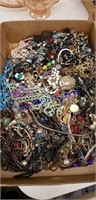 Box lot of unsorted  jewelry