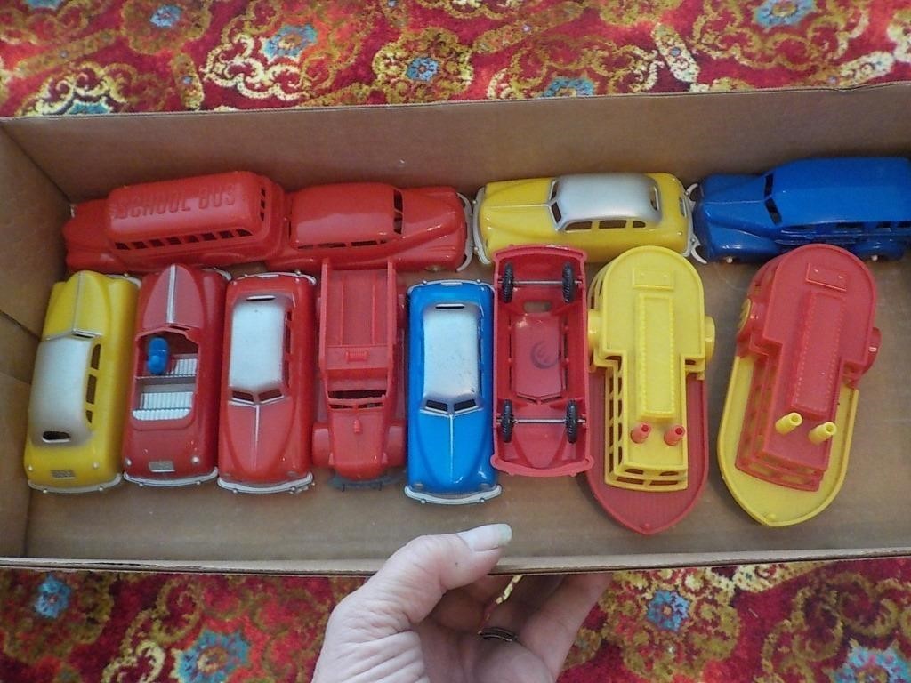 Vintage plastic cars and boats for train platform