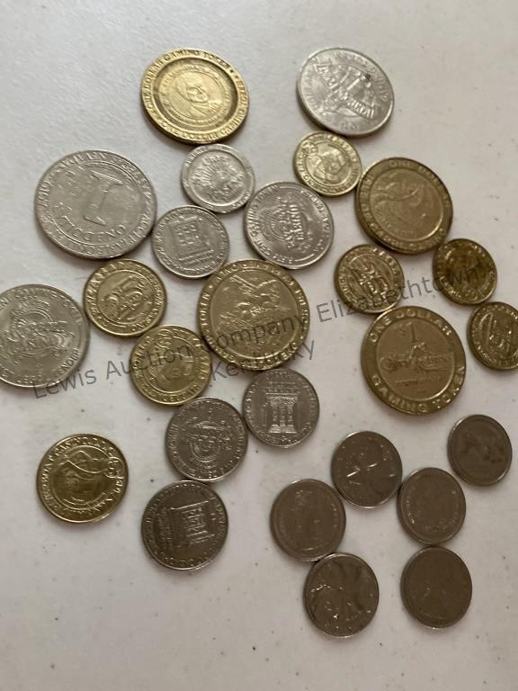 Assortment of casino tokens and Canadian quarters