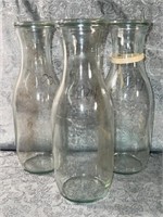 (H) 3 WECK Glass one quart milk jugs with lids.