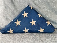 (H) Aged folded American Flag.