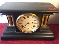 Unmarked Black Columned Mantel Clock. 8 Day Time .