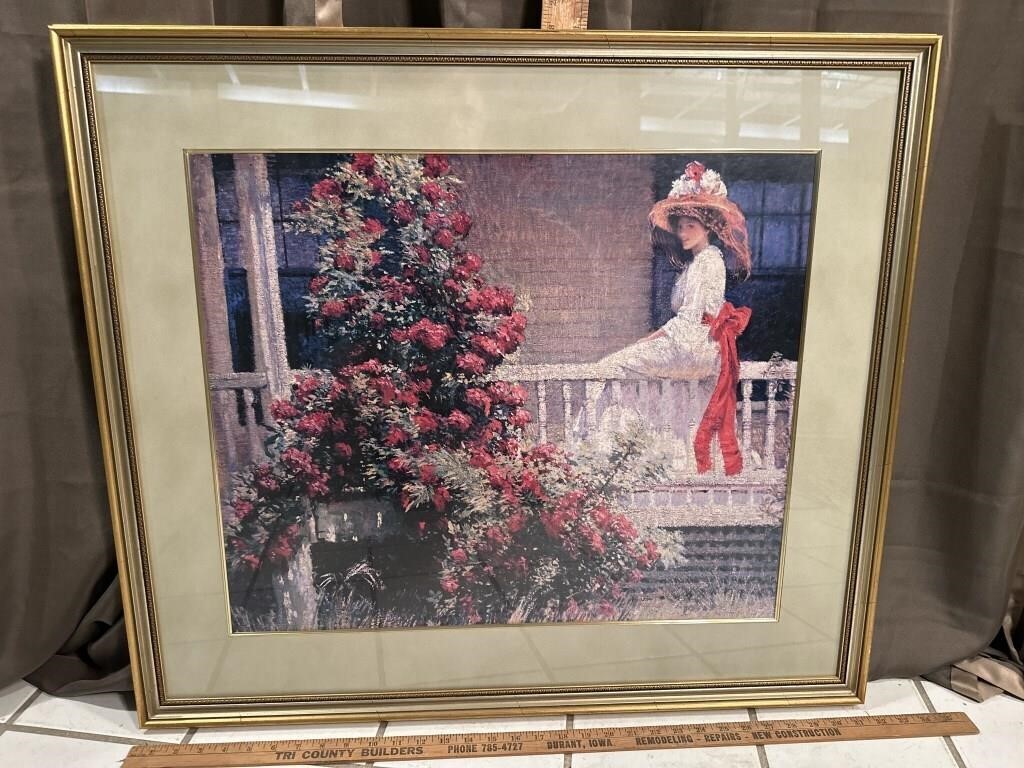 Lady seated on porch railing picture