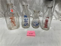 Four Glass Milk Bottles