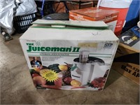 The Juiceman II automatic juice extractor used