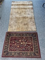 (2) Rugs 3’ x 5’ and 38.5” x 27” (tan rug has red