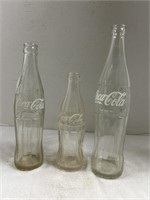 3 clear glass vintage Coca Cola bottles 6 and a