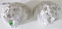 2 lion head figures