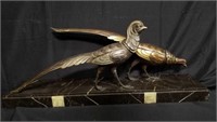 Signed spelter bird sculpture on marble