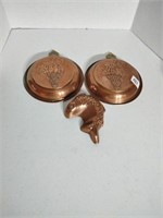 Group of 3 copper moulds.