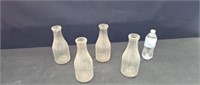 (4) quart milk bottles