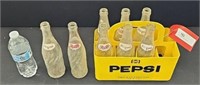 (8) Pepsi bottles in plastic Pepsi carrier