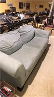 Overstuffed Sofa in a light green micro fabric