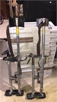 Pair of drywall stilts, aluminum with the straps,