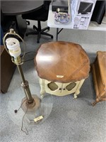 Glass lamp and wood round cabinet