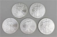 5 2010 One Ounce Fine Silver Eagles.