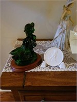 Green glass goebel girl and club member stand