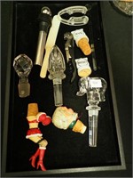 Container of bar-related items, mostly stoppers