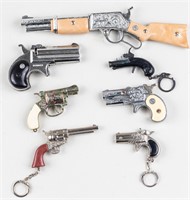 7 SMALL TOY CAP GUNS