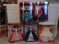 Five Barbie dolls: