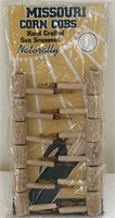 Missouri corn cob pipe display with 12 pipes