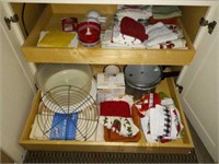 Items in cabinet left of kitchen sink
