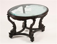 CARVED GLASS TOP DOLPHIN-FOOTED TABLE
