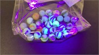 UV reactive marble lot. About 28 in bag.