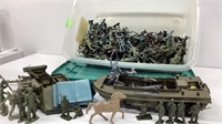Tub of plastic army men and pontoon boat, camping