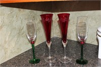 Four red and green bar glasses