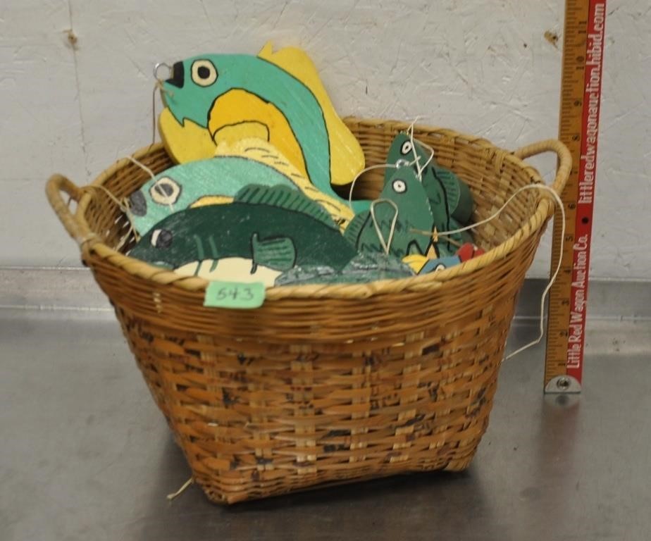 Hand crafted wood fish decor in basket