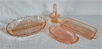 Pink Depression glass serving dishes and small