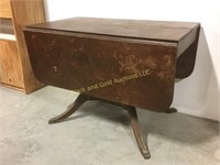 Drop leaf table with brass capped claw feet