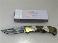 NIB Damascus folder pocket knife.