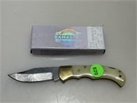 NIB Damascus folder pocket knife.