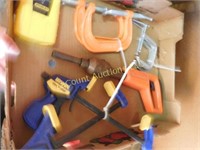 box of clamps, stud finder, cement nail driver
