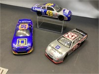 Three model racing cars