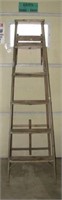 Five step wood ladder. Measures  70" tall.