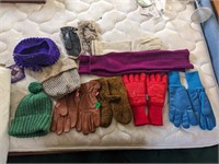 Assortment of womens winter gloves, beanies