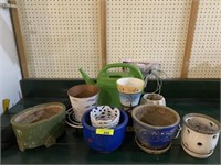 Assortment of Flower Pots, Watering can, & Weed