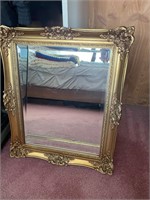 Square gold tone mirror