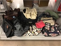Assorted fashion handbags.