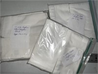 23 white cloth napkins
